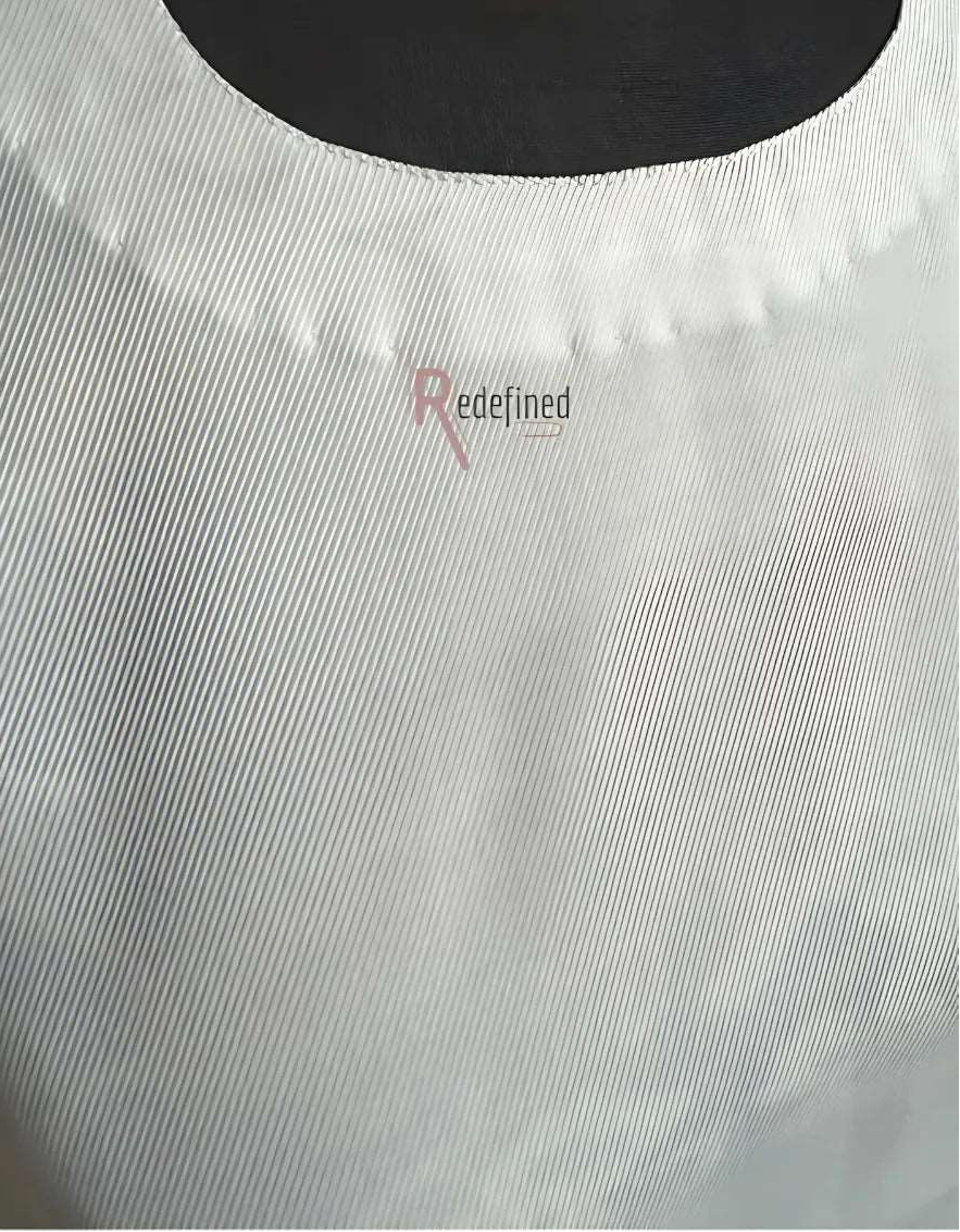 A Close up of the fabric in white showing self print