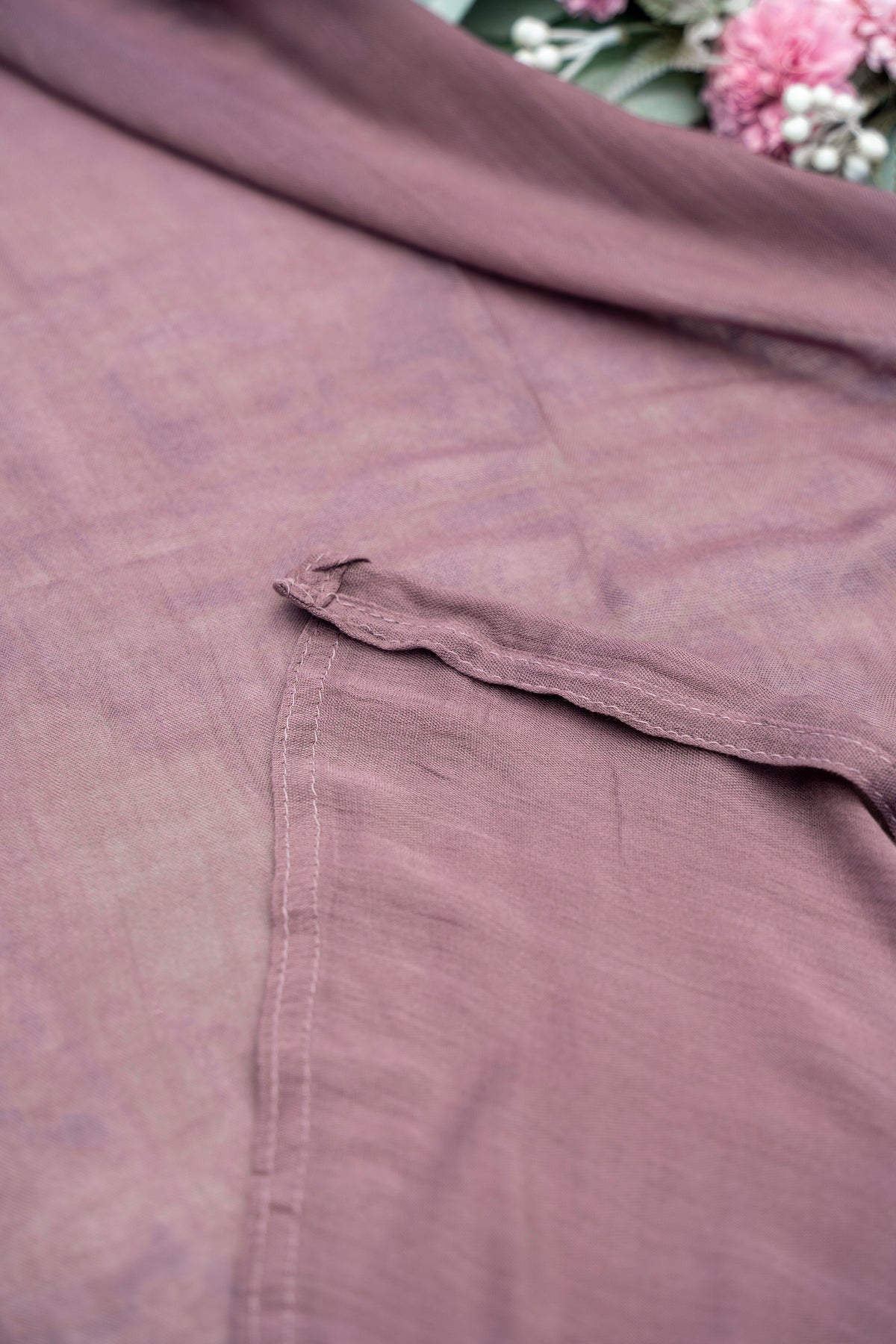 Close-up of a brown fabric with floral background