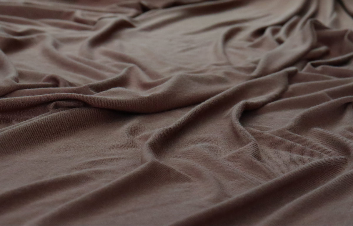 Brown fabric with flowers in the background
