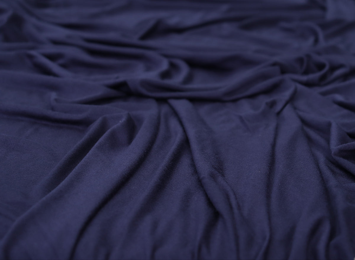 Navy blue fabric draped over a surface