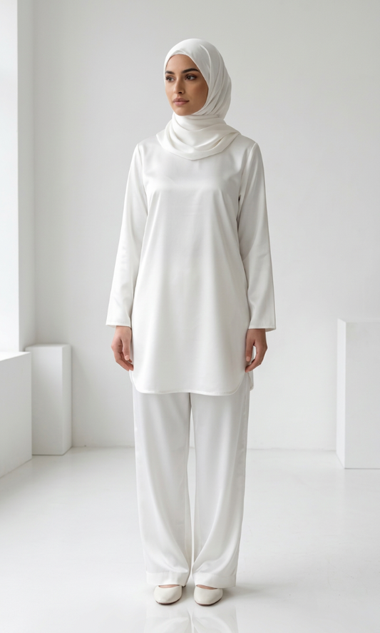 A standing woman wearing white coord set