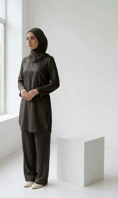 A standing woman wearing black coord set
