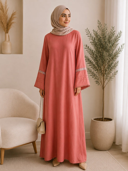 Elegant dusty rose pashmina abaya dress featuring embroidered wide sleeves, a flowing maxi silhouette, and a modest relaxed fit.