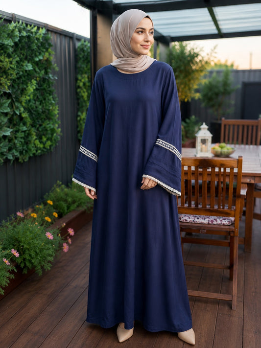 Elegant navy blue pashmina abaya dress featuring embroidered wide sleeves with lace trim, a flowing full-length silhouette, and a relaxed modest fit.