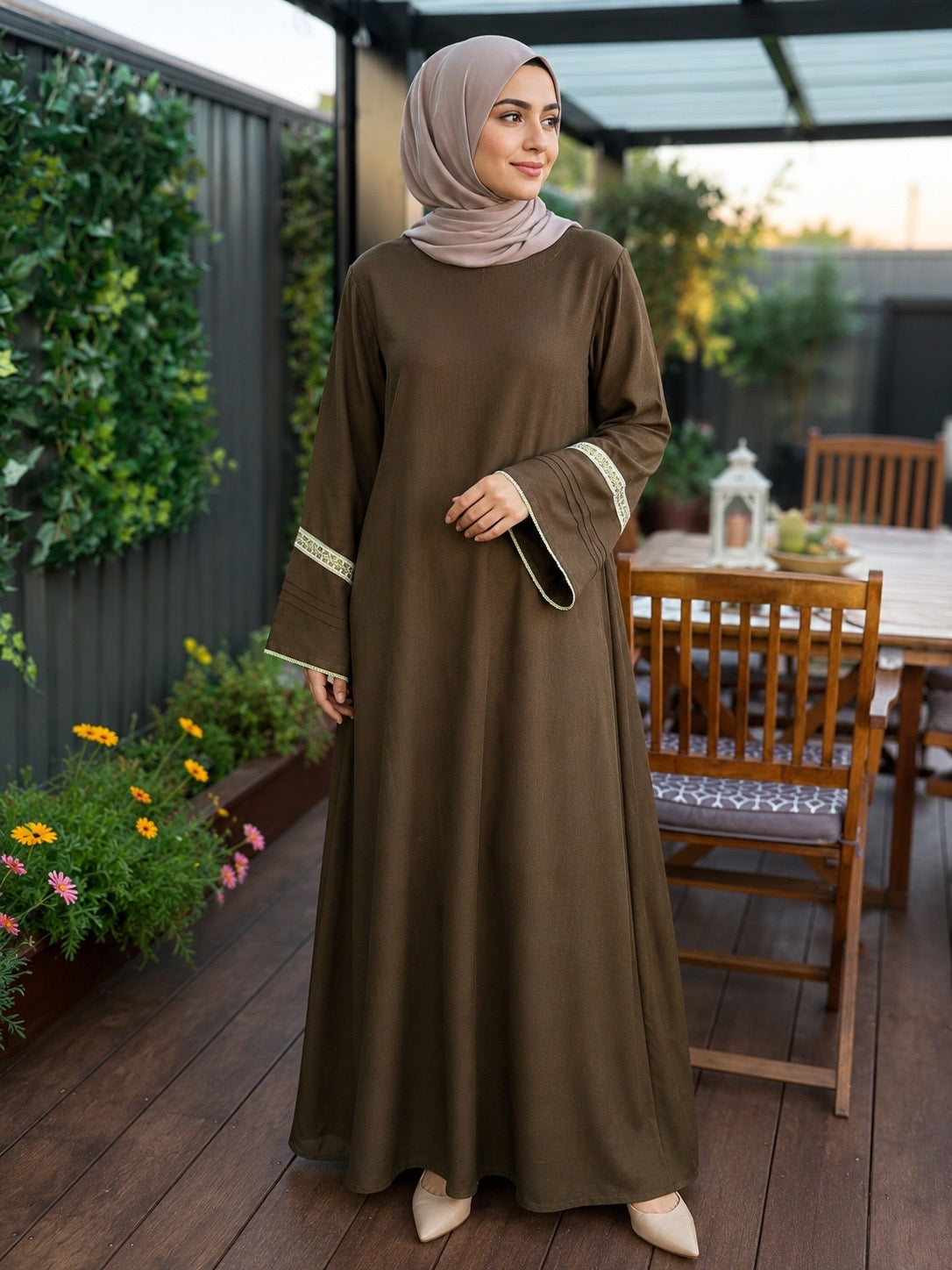 Elegant mocha brown pashmina abaya dress featuring embroidered wide sleeves, a flowing maxi silhouette, and a modest relaxed fit.