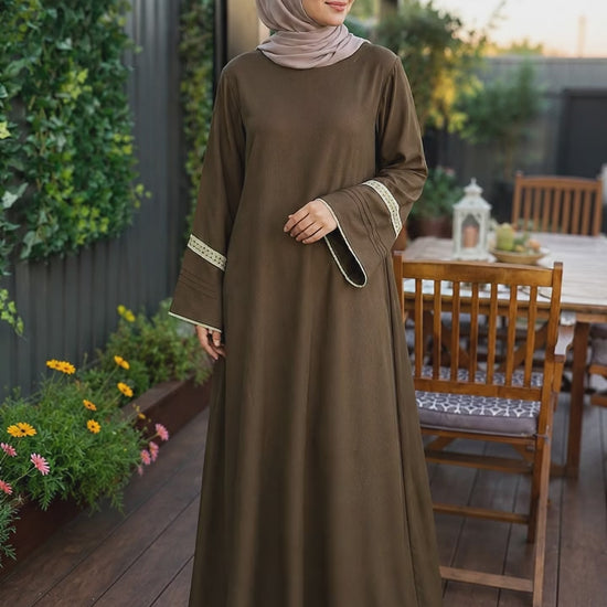 Elegant mocha brown pashmina abaya dress featuring embroidered wide sleeves, a flowing maxi silhouette, and a modest relaxed fit.