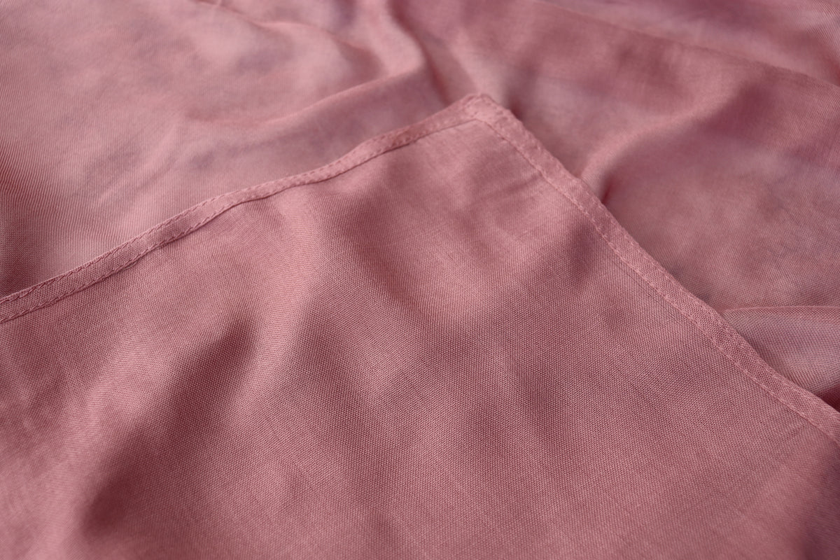 Pink fabric fold showing stitch