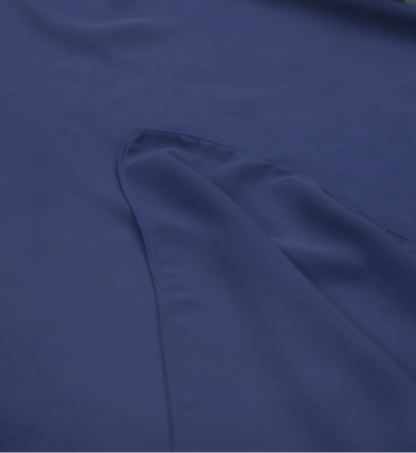 Navy blue fabric with a floral arrangement in the corner