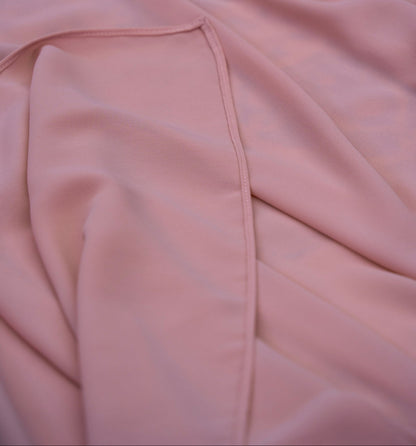 Close-up of a pink fabric with a fold