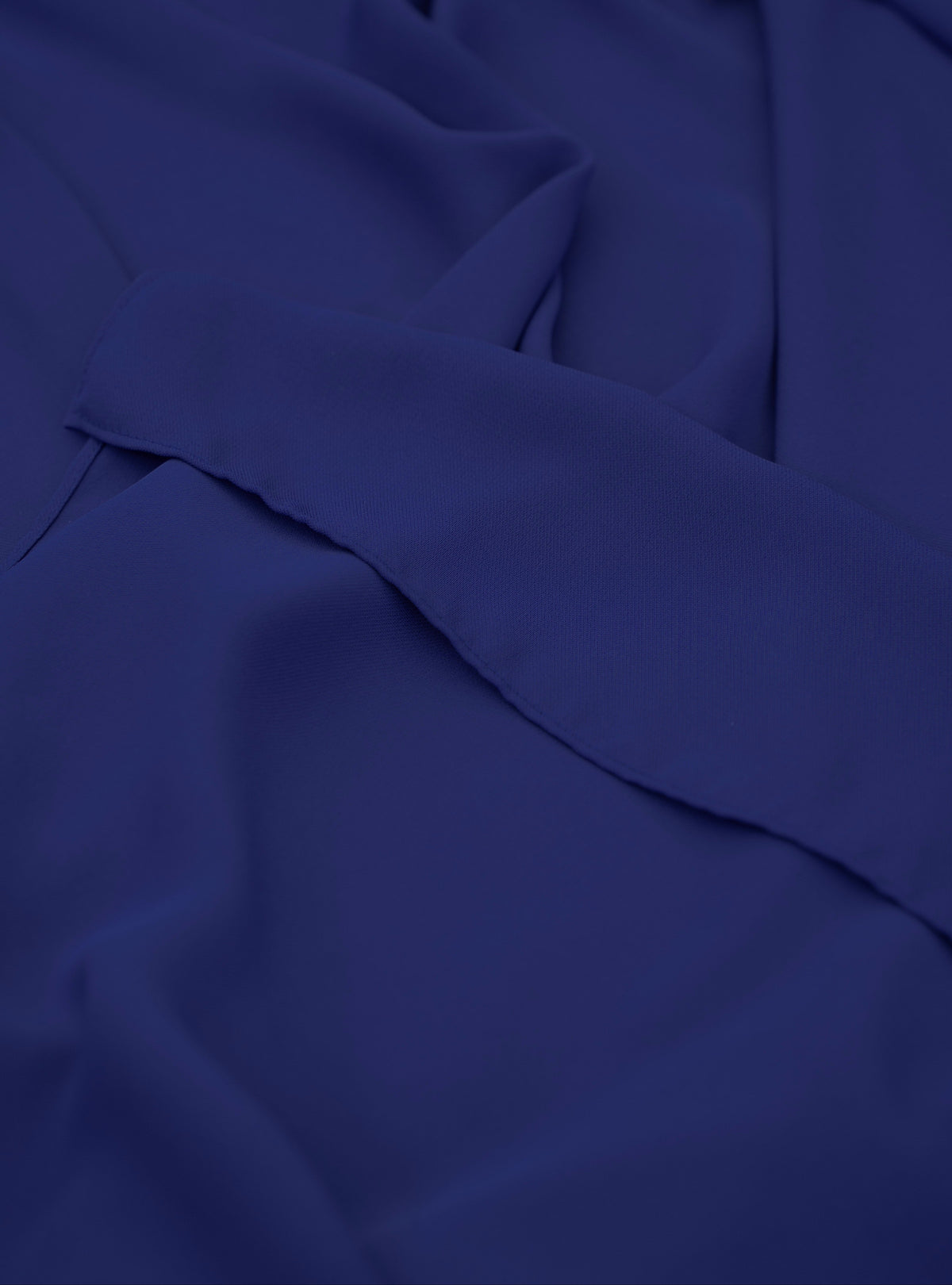 Navy blue fabric with a fold