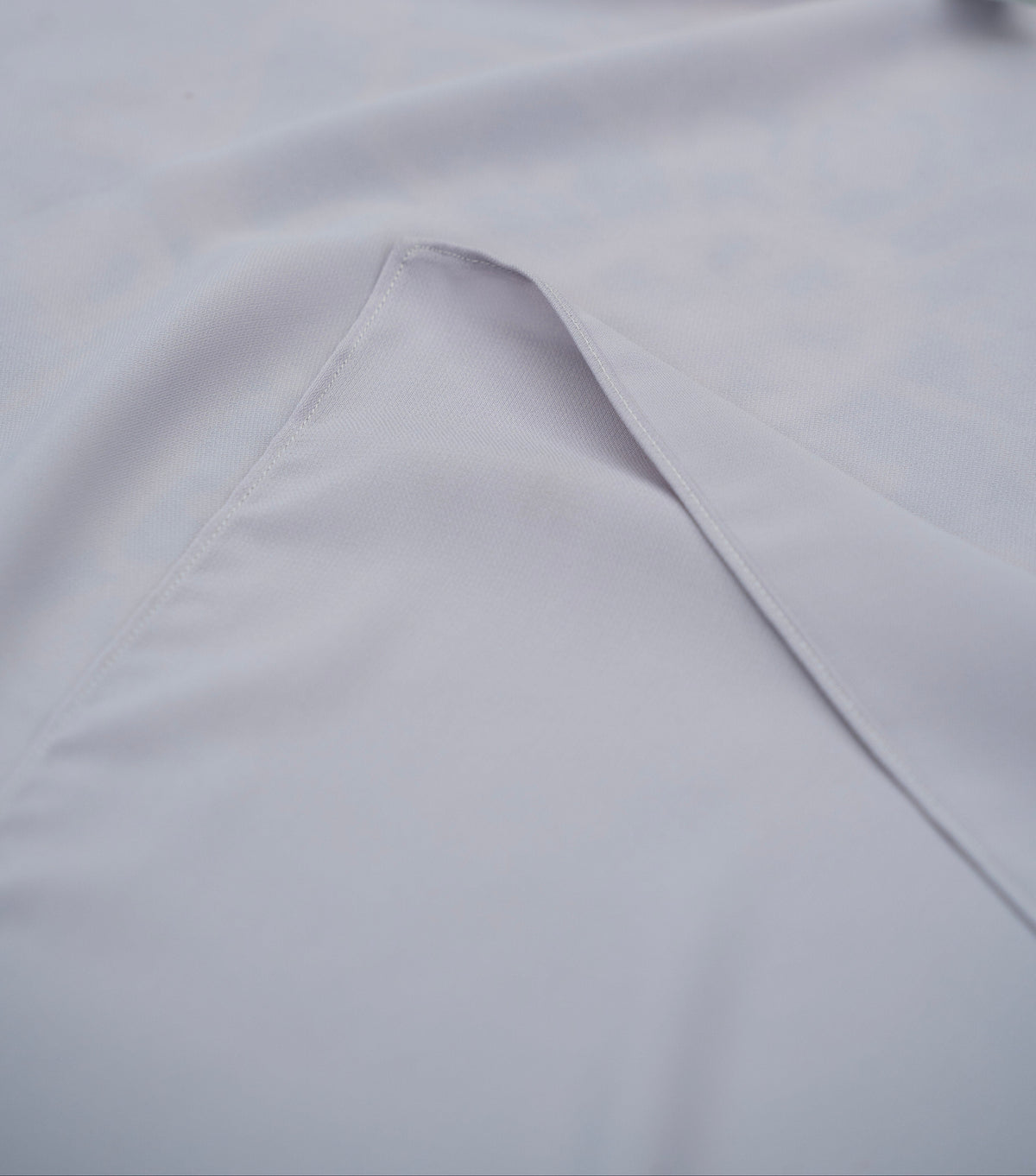 Close-up of light purple fabric with a a fold