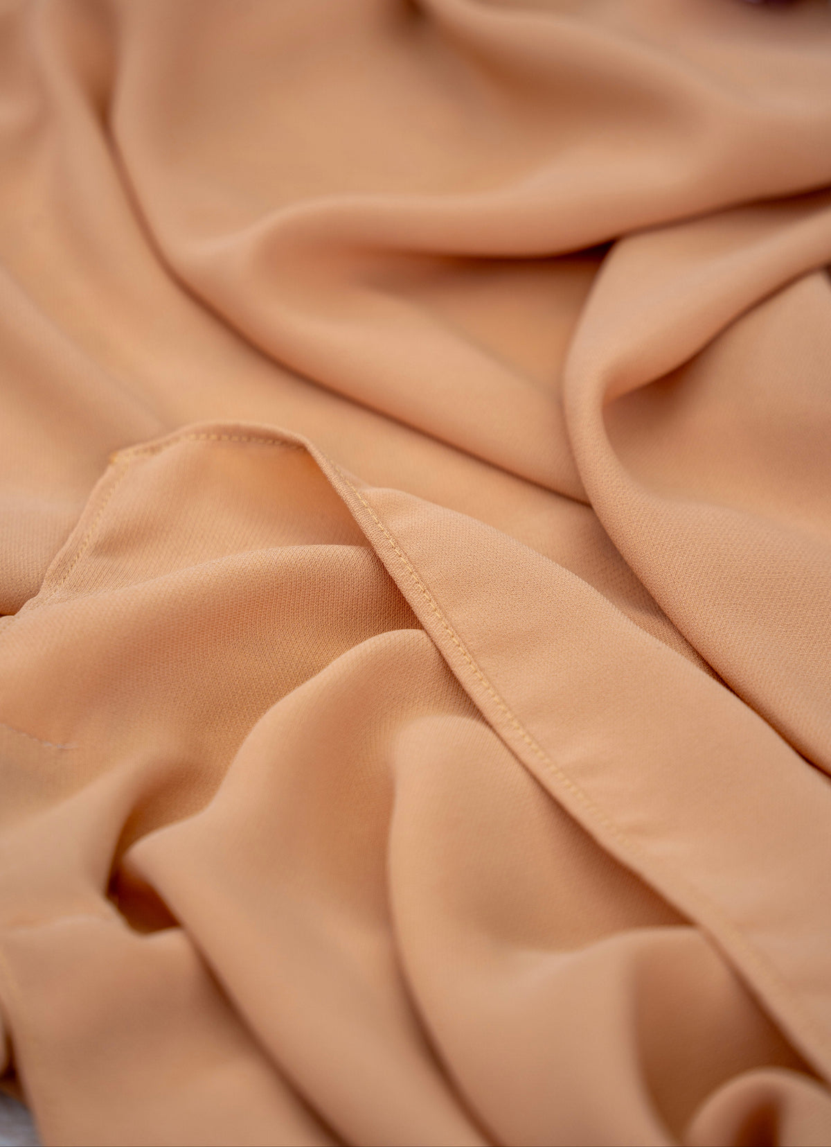 Close-up of beige fabric with a soft texture