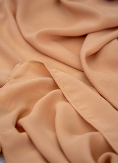 Close-up of beige fabric with a soft texture