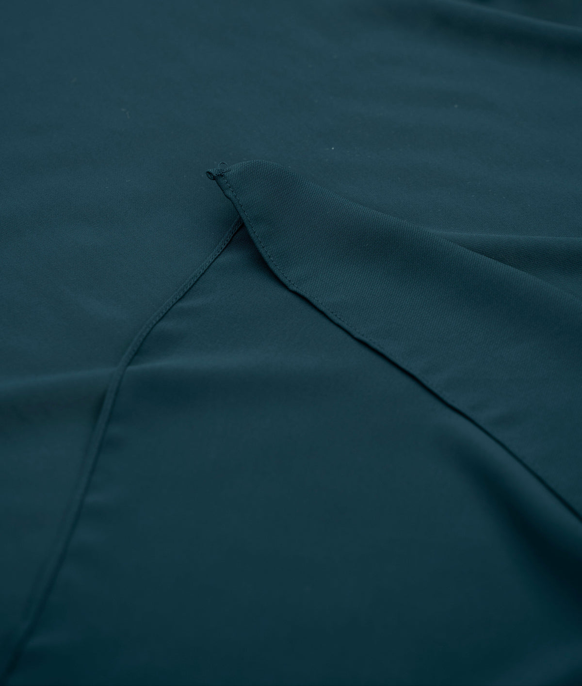 Teal fabric with a fold