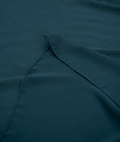 Teal fabric with a fold