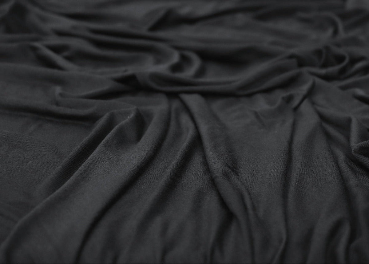 Black fabric draped over a surface