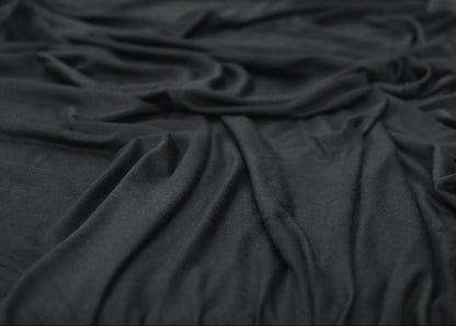 Black fabric draped over a surface