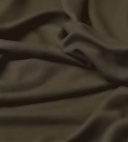 Close-up of a brown fabric with some folds